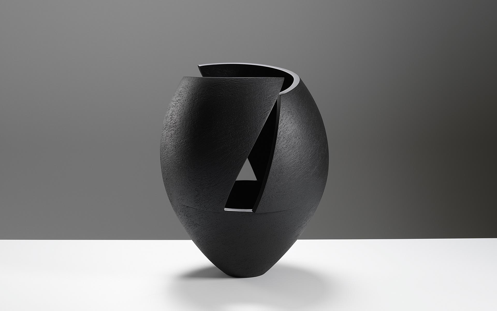Cut and altered black bowl