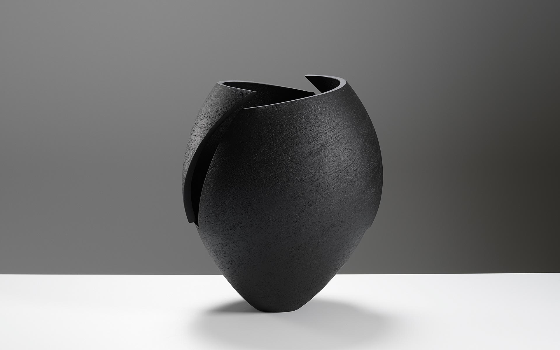 Cut and altered black bowl