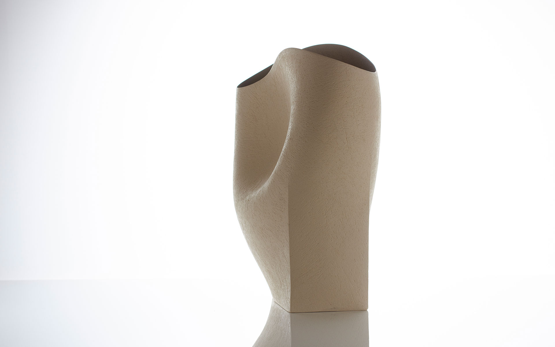 Undulating vessel with grey interior
